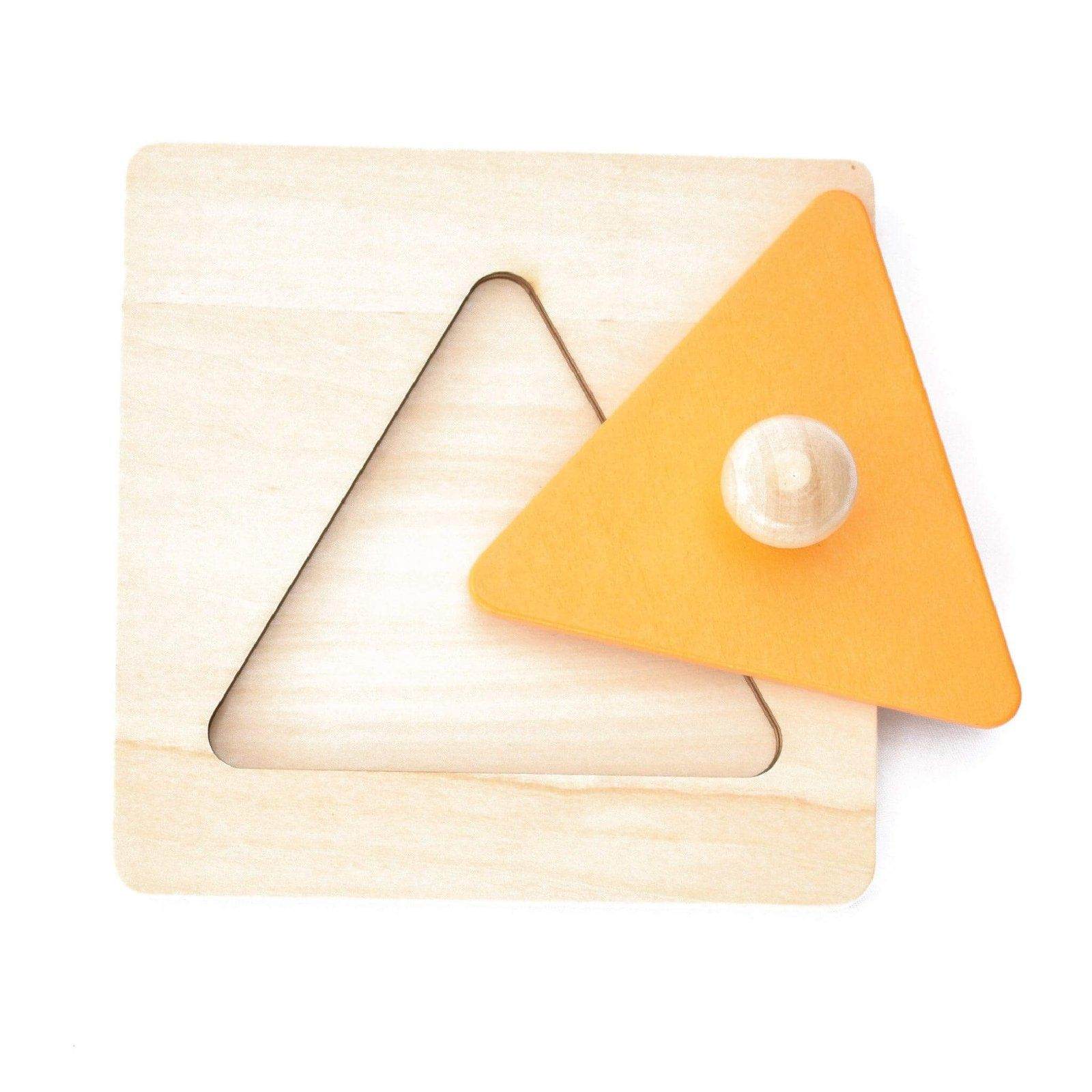 Close up of a orange triangle single shape puzzle